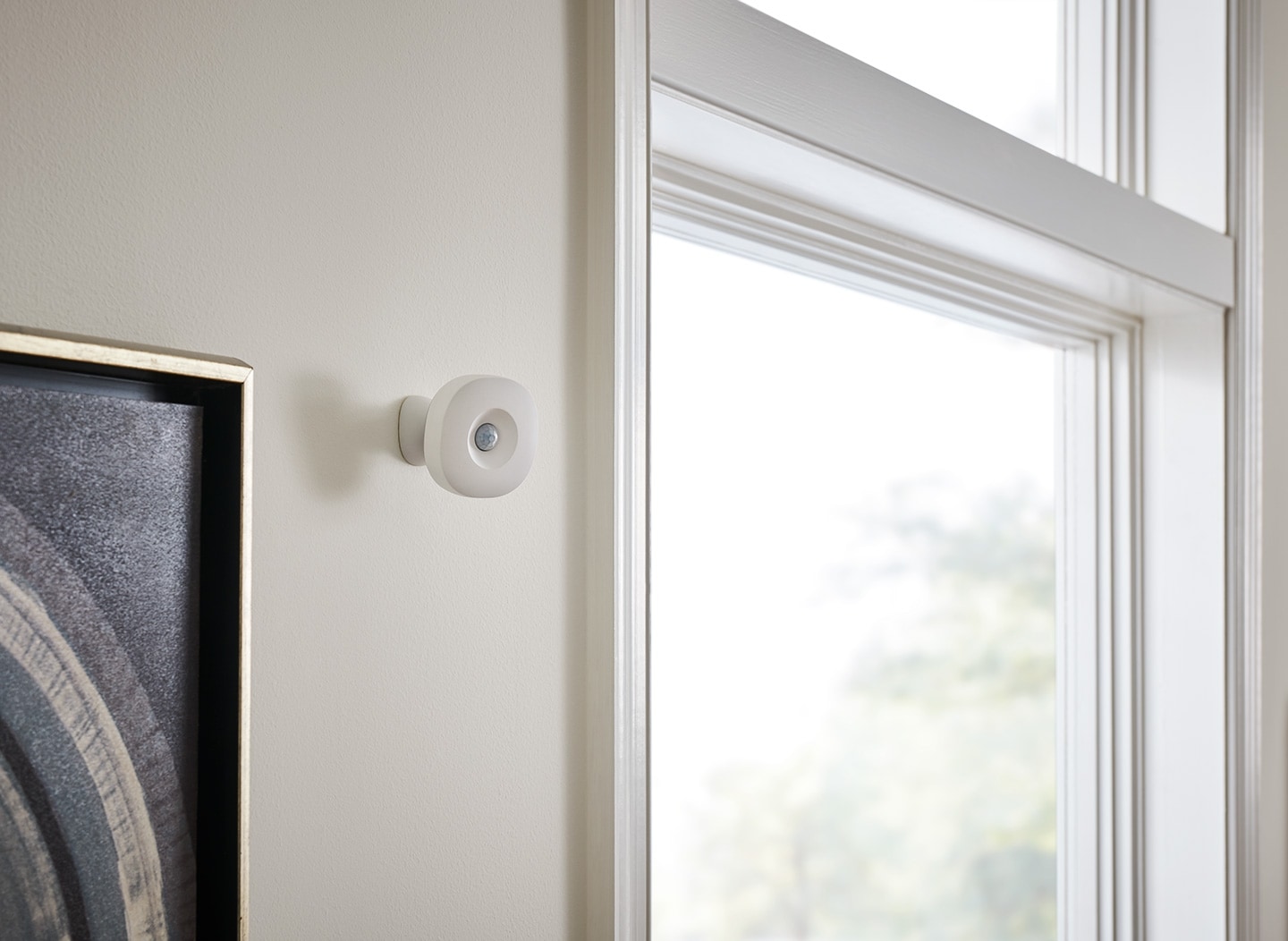 Samsung SmartThings Motion Sensor Installed on a Wall Next to a Window