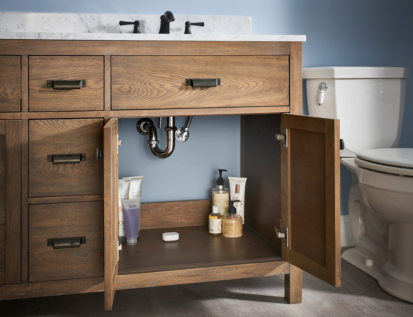 SmartThings Water Leak Sensor Installed Under a Sink in a Cabinet