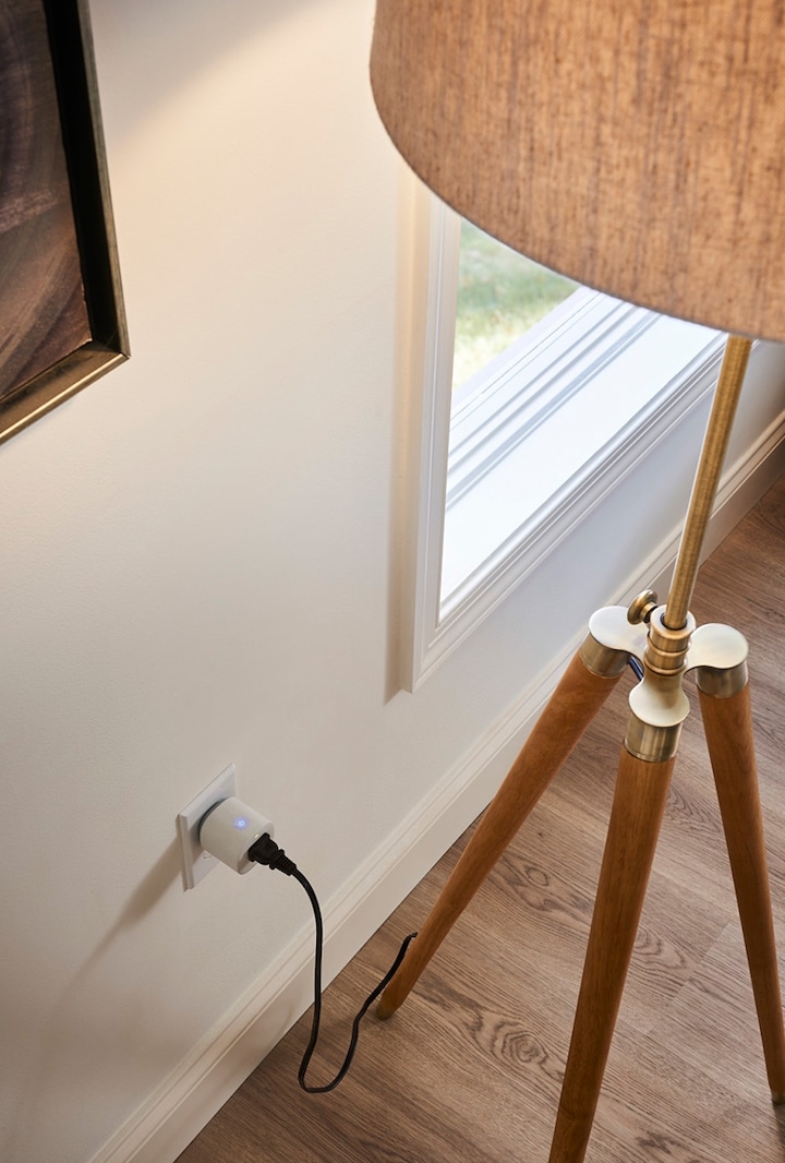 A Modern-Design Lamp Plugged Into the SmartThings Outlet That's Plugged Into a Home Outlet