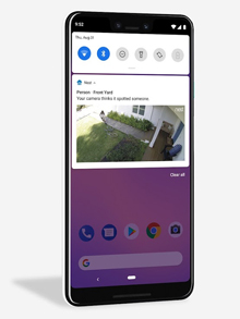 The house owner is alerated on phone when a person shows in the front yard.