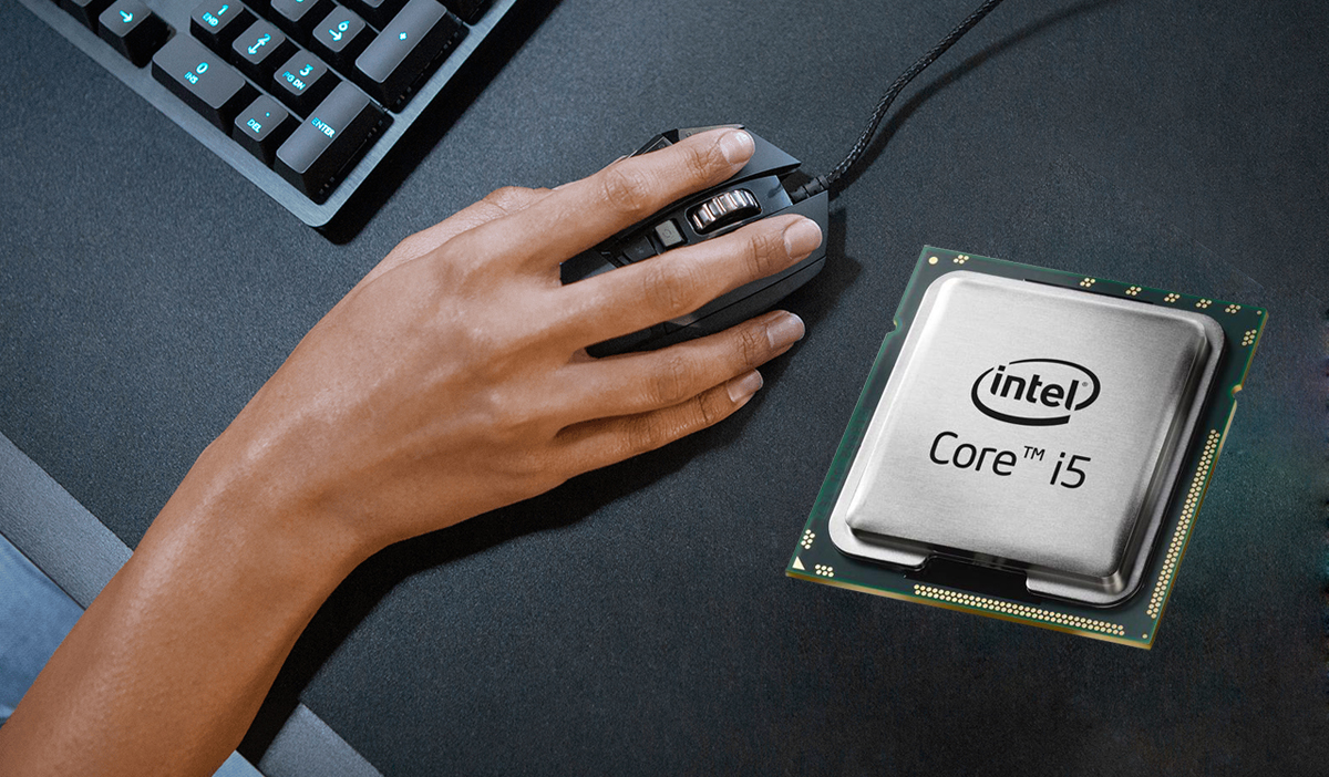 Intel Core i5 9th Gen 9600K processor is placed on a desktop with part of akeyboard and a hand holding a mouse next to it.