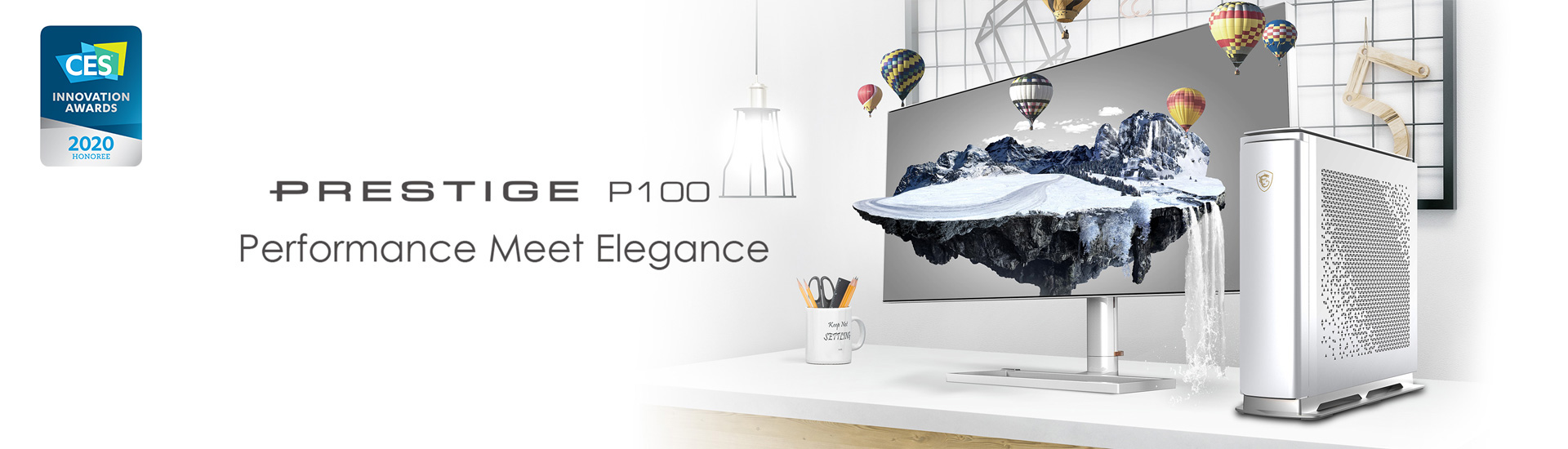 Prestige P100 computer next to a monitor with a mountain scenery and many Hot Air Balloon as screen