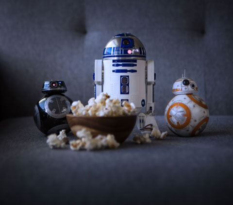 BB-9E, R2-D2 and BB-8 Next to a Bowl of Popcorn, Looking Forward