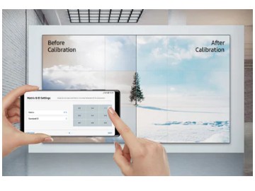 SAMSUNG VM46R-U Display with an Evergreen Tree on a Snowy Mountain, the image is being adjusted by someone using a smartphone