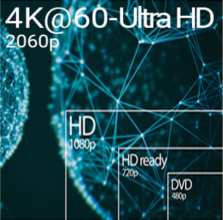 a man working with an iMac and a laptop on his desk