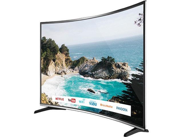 The BOLVA 55CSV02 display facing to the right showing a daytime image of a beach cove with light green-blue water by the beach and ocean blue behind the cliffside