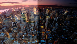 Avera TV Showing an Overhead View of a City Skyline at Twilight Hour, half of the image is dimmer than the other