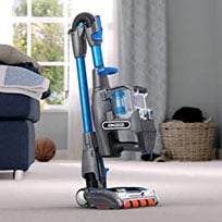 Shark IONFLEX Vacuum Standing Up, Angled to the Right in a Living Room