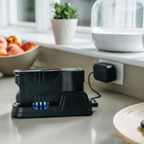 The Shark IF200W Vacuum's Removable, Rechargeable Batteries Charging in a Kitchen