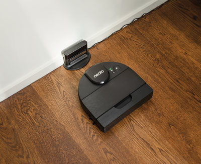 Neato D9 is approaching a charger stationed near wall