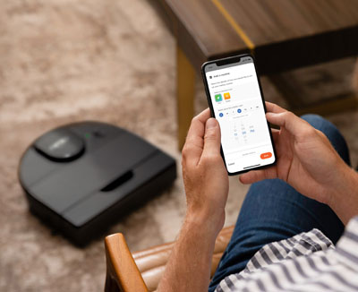 User is controlling Neato D9 via an app on phone.