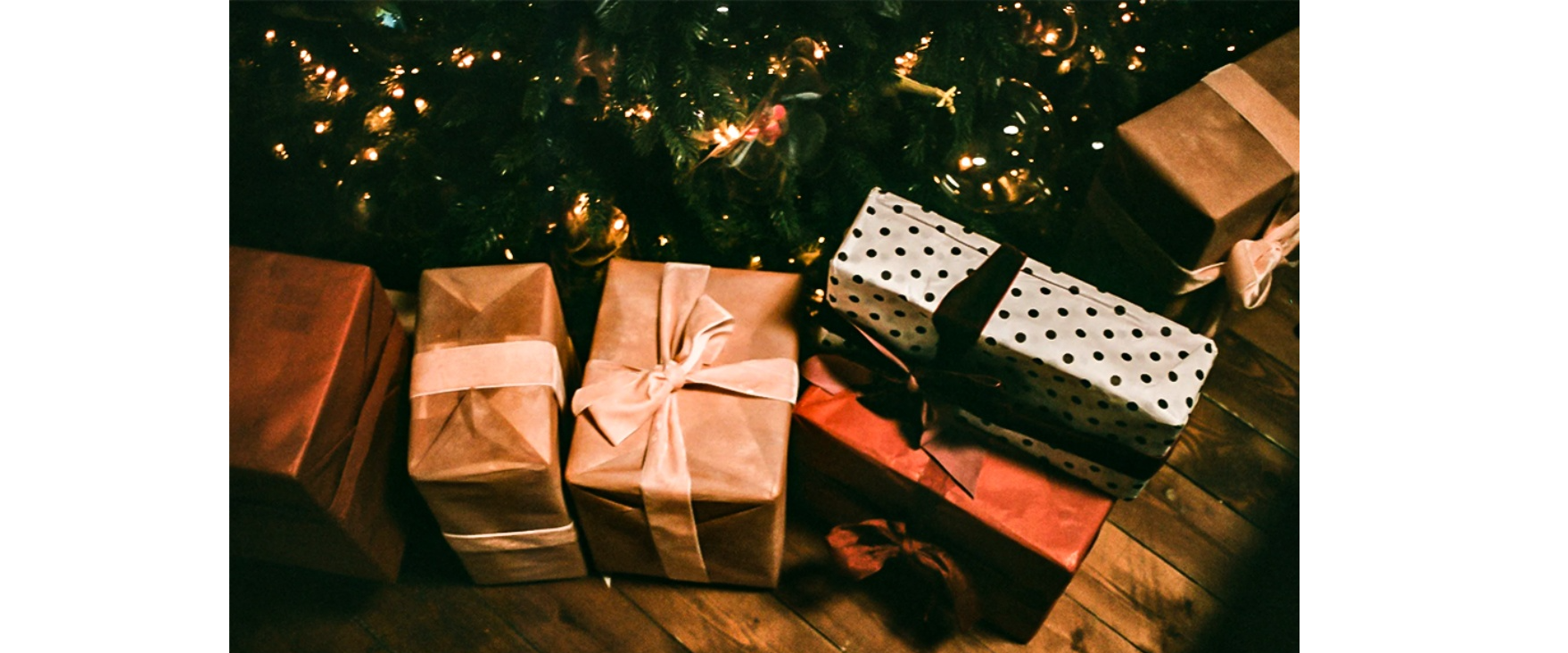 Christmas gift boxes with warm fairy lights,festive holiday atmosphere