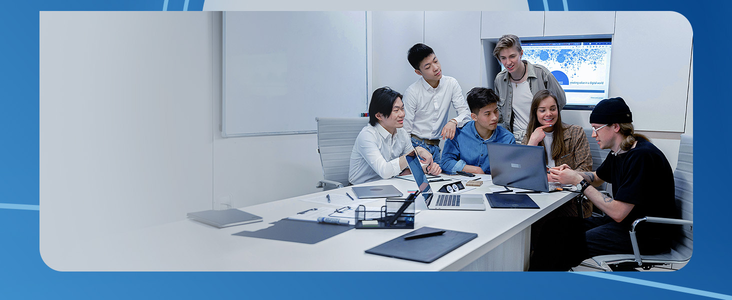 People starring at a laptop and discussing in a conference room