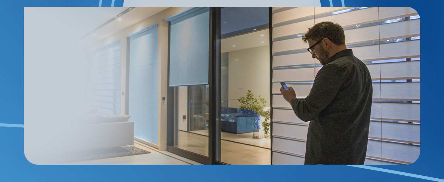Man looking at his phone in front of his smart home