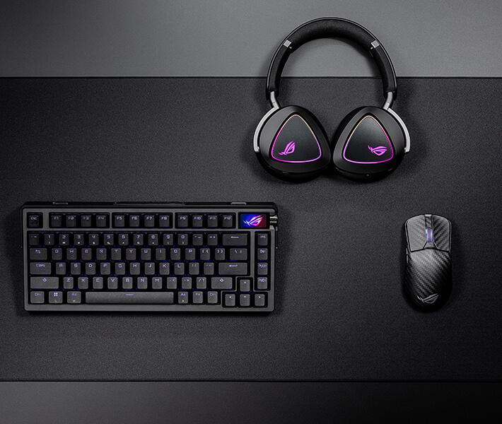A top view of the ROG Harpe Ace Extreme, set on the Hone Ace XXL Mousepad and placed next to the Azoth Extreme and the Delta II wireless to showcase the synchronized RGB colours