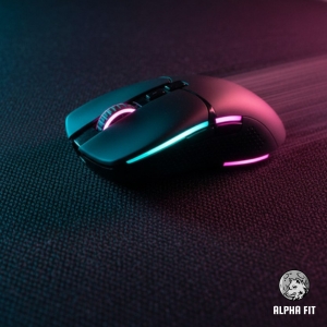 Gaming mouse gliding smoothly on micro-woven cloth surface for precision aiming.
