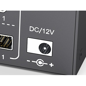 With a 12V power adapter.  Eliminated the situation of monitor flickering and insufficient power su