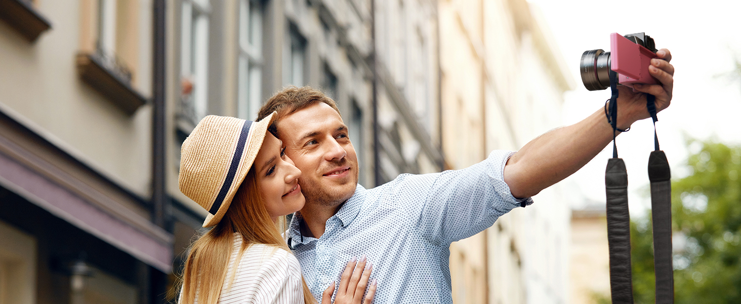 Pink flip screen digital camera for couple city travel selfie vlogging