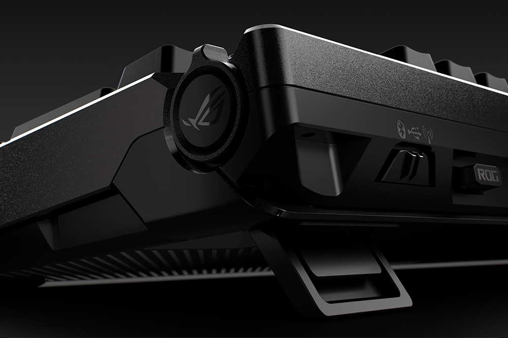 Focused view of the ROG Azoth 96 HE three-way control knob and connectivity toggle switch