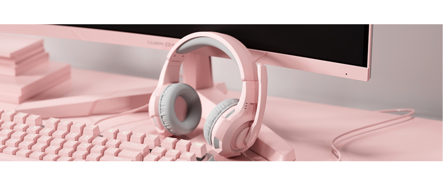 Pink headset on pink gaming desk, aesthetic setup