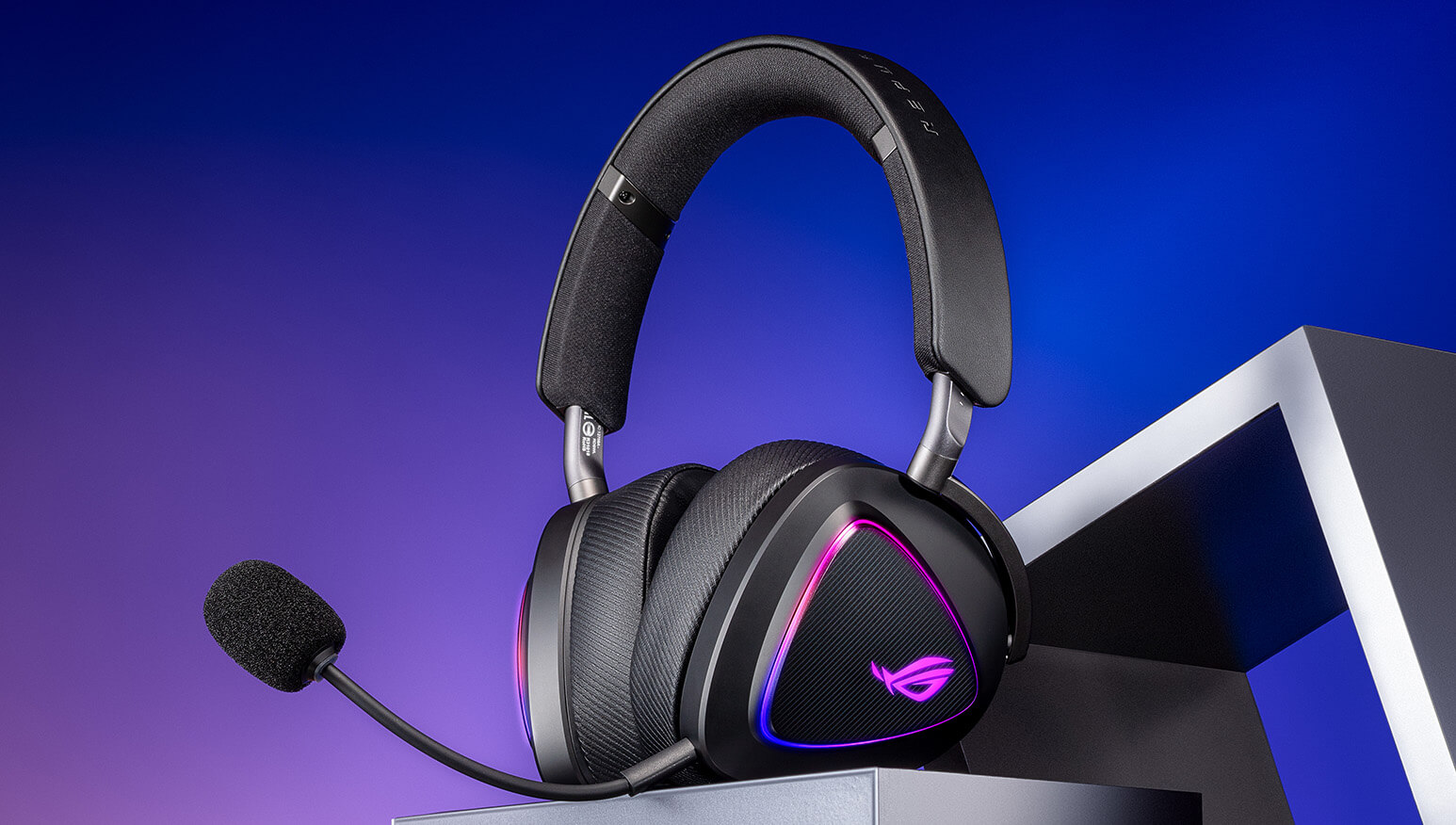 ROG Delta II in silver standing on a shelf, highlighting its premium build, metal hinge design and D-shaped earcups