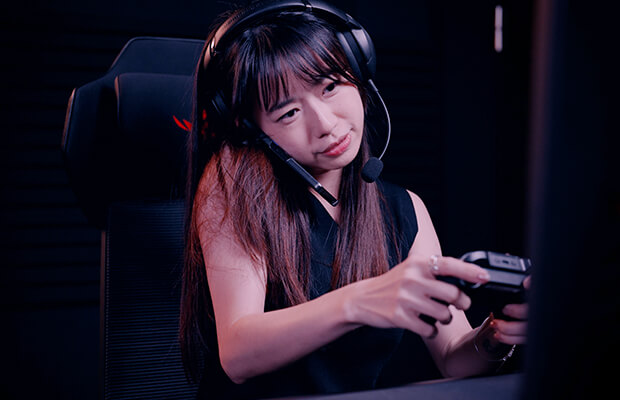 Illustration of a general gaming headset, showing the user removing the headset to take a phone call mid-game
