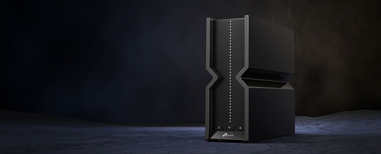 TP-Link Archer BE550 router with 6 antennas front view on dark background