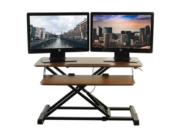 Photo 1 of TechOrbits Standing Desk - Stand Up Desk Converter And Monitor Riser - Height Adjustable Sit Stand Tabletop Workstation Wood Brown