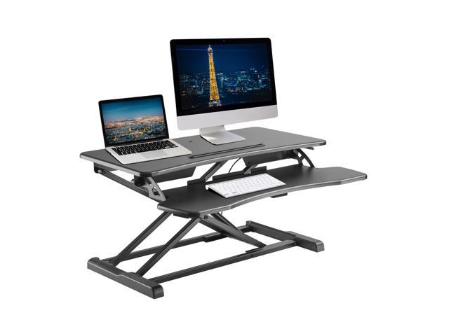Photo 1 of Standing Desk Converter - 32" Height Adjustable Stand Up Desk Riser - Sit to Stand Desktop Workstation
