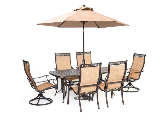 Hanover Manor 7 Piece Sling Outdoor Dining Set With 2 Swivel Rockers 4 Dining Chairs A Cast Top Table Umbrella And Stand Newegg Com