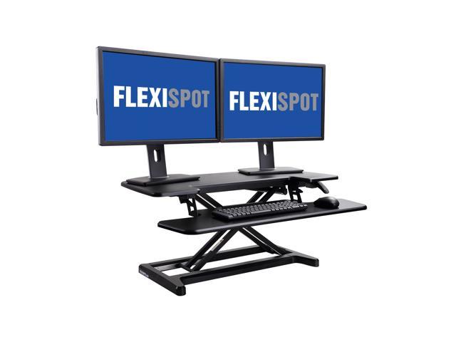 Photo 1 of FlexiSpot Stand Up desk Converter -35" Standing desk Riser with Deep Keyboard Tray for laptop (35", Black)