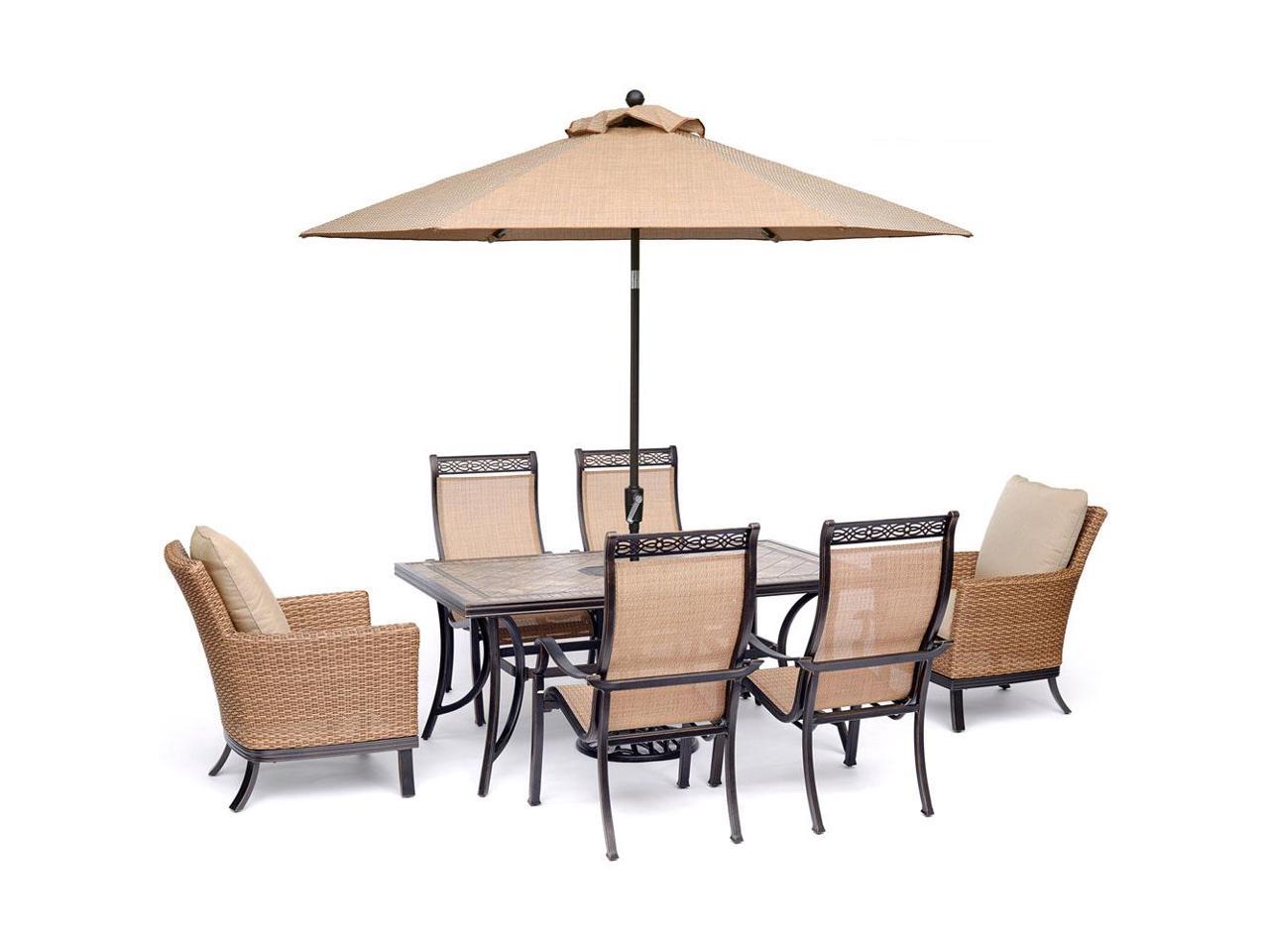 Hanover Monaco 7 Piece Patio Dining Set With 2 Woven Armchairs 4 Pvc Sling Chairs 40 X 68 Tile Top Table 9 Ft Umbrella And Stand Newegg Com