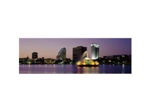Panoramic Images PPI73015L Fountain in a lake lit up at night  Lake Eola  Summerlin Park  Orlando  Orange County  Florida  USA Poster Print by Panoramic Images - 36 x 12
