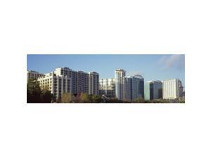 Panoramic Images PPI127701L Skyscrapers in a city  Lake Eola  Orlando  Orange County  Florida  USA Poster Print by Panoramic Images - 36 x 12