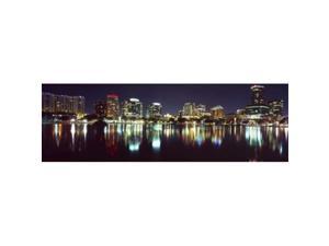 Panoramic Images PPI127706L Buildings lit up at night in a city  Lake Eola  Orlando  Orange County  Florida  USA 2010 Poster Print by Panoramic Images - 36 x 12