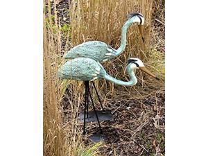 ancient graffiti standing and bowing steel heron pair outdoor decor