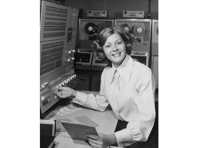 Businesswoman operating a computer Poster Print (24 x 36)