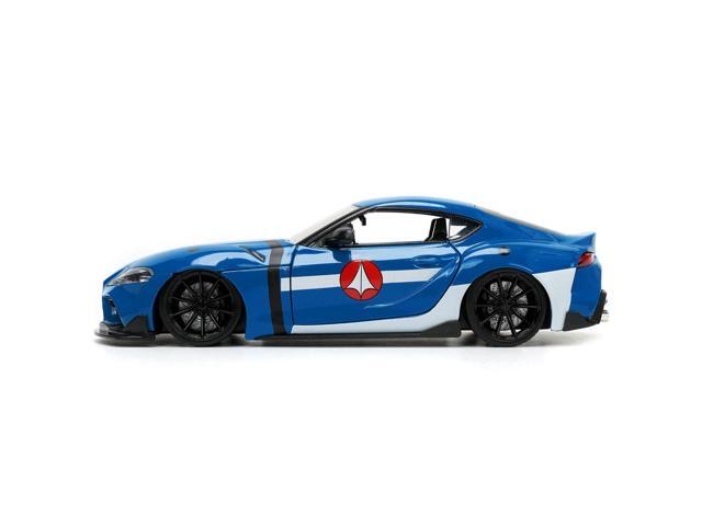 2020 Toyota Supra Blue with Graphics and Max Sterling Diecast Figurine 'Robotech' 'Hollywood Rides' Series 1/24 Diecast Model Car by Jada