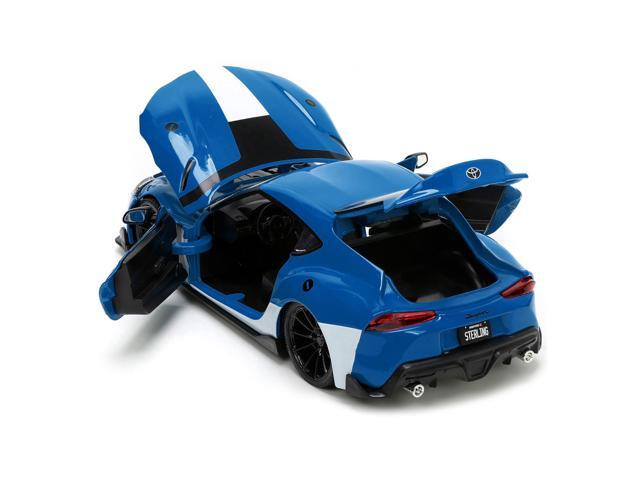 2020 Toyota Supra Blue with Graphics and Max Sterling Diecast Figurine 'Robotech' 'Hollywood Rides' Series 1/24 Diecast Model Car by Jada