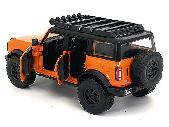 2021 Ford Bronco Orange with Black Stripes and Roof Rack 'Just Trucks' Series 1/24 Diecast Model Car by Jada