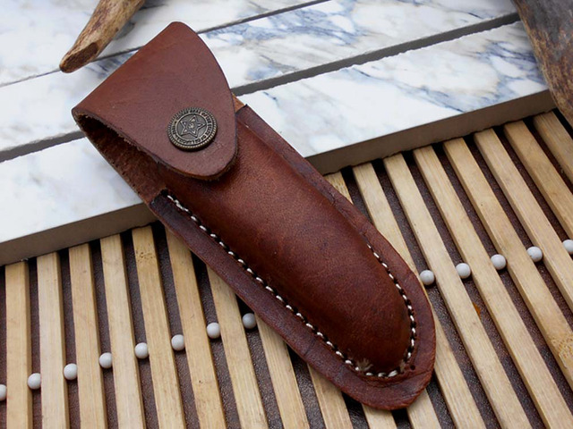Laguiolle Folding Damascus steel knife. hand forged custom twist pattern 4' Blade. Available in various scales with brass bolster. Cow hide leather...