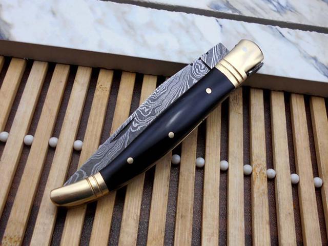 Laguiole Folding Damascus steel knife. hand forged custom twist pattern 4' Blade. Available in various scales with brass bolster. Cow hide leather...