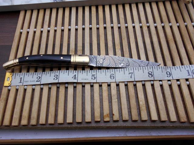 Laguiole Folding Damascus steel knife. hand forged custom twist pattern 4' Blade. Available in various scales with brass bolster. Cow hide leather...