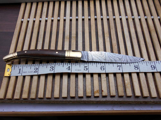 Laguiolle Folding Damascus steel knife. hand forged custom twist pattern 4' Blade. Available in various scales with brass bolster. Cow hide leather...