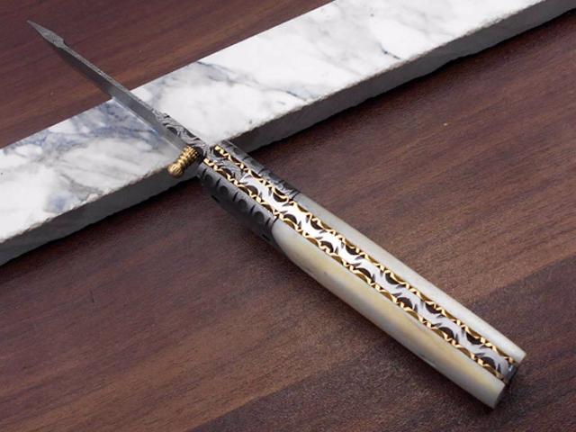 Damascus steel Tanto blade Folding Knife, equipped with Thumb knob & liner lock, Available in various natural scales with Damascus bolster, Cow...