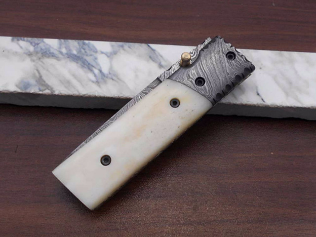 Damascus steel Tanto blade Folding Knife, equipped with Thumb knob & liner lock, Available in various natural scales with Damascus bolster, Cow...