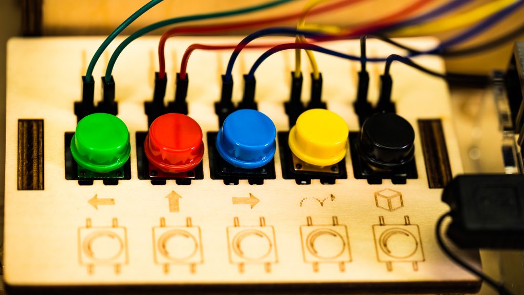 Piper's software allows kids to program responses for the physical buttons, which translate to different actions in the game.