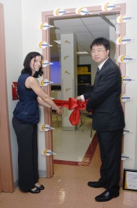 Ms. Deak and Newegg's Kevin Lee cut the ribbon Ms. Deak and Newegg's Kevin Lee cut the ribbon