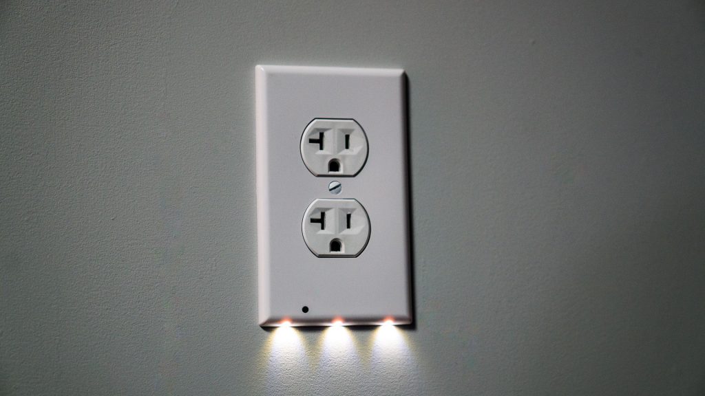 LED outlet covers like SnapPower use a light sensor to activate the LEDs when it is dark, and turn them off during the daytime. 