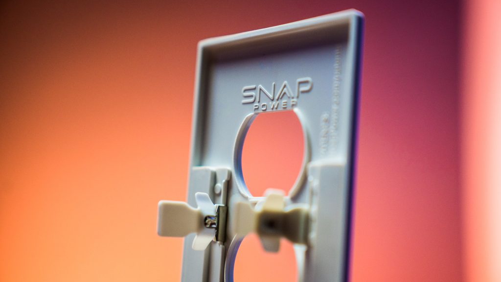 Two metal touchpoints complete a circuit on the back of the SnapPower LED and USB outlet covers, which gives them power without any alterations. 